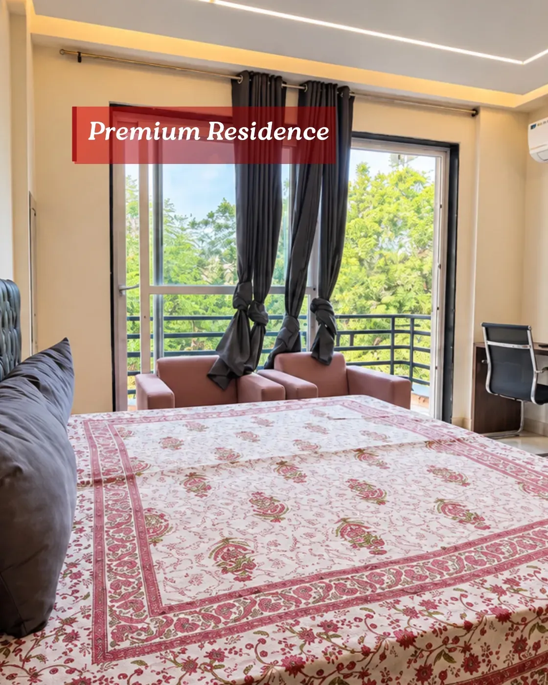Private room at Omsorg Sector 57 with a bed, armchair and large window
