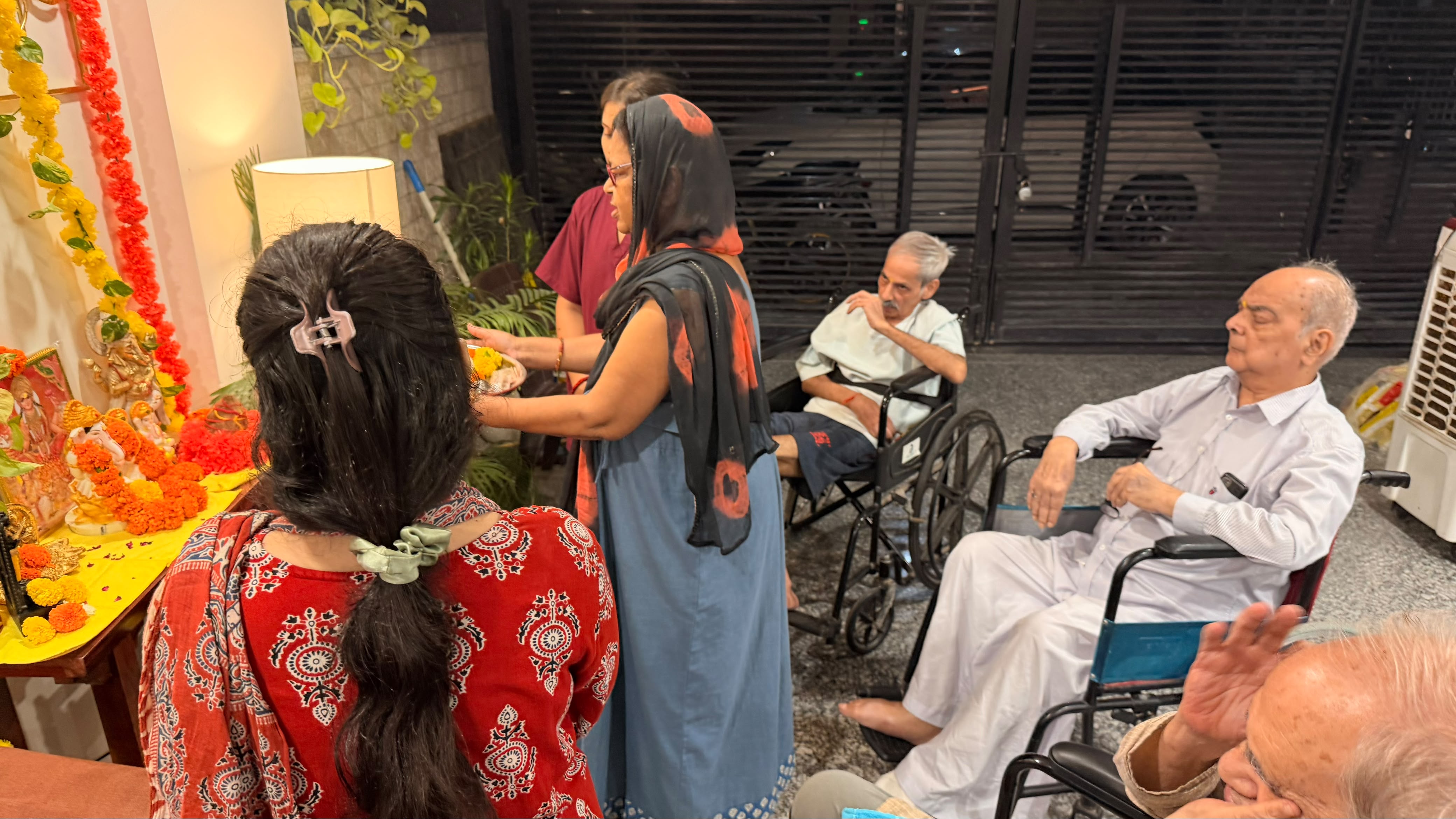 Elders participating in festival pooja and community prayer
