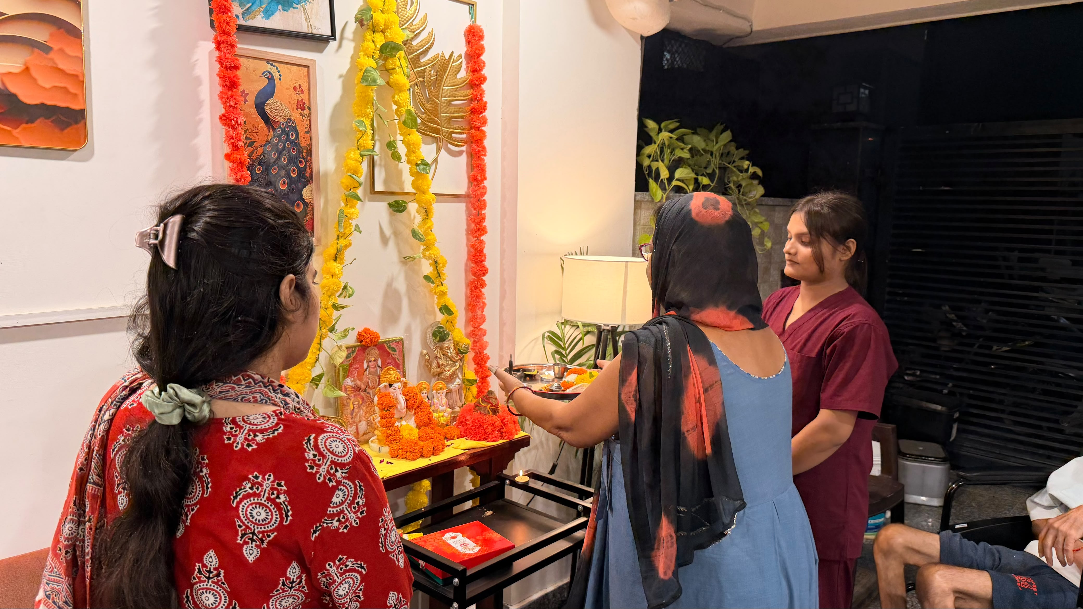 Festive floral decorations and community worship at the residence
